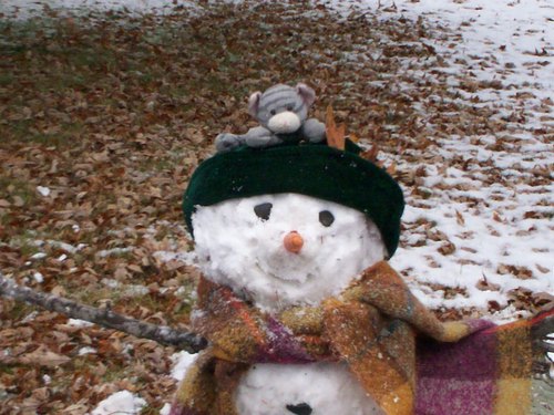 Kitty says bye to Snowman